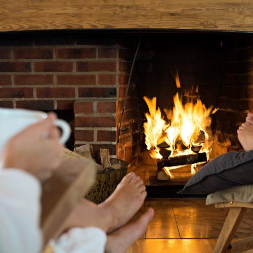 Warm your feet by the open fire