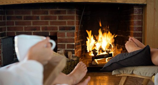Warm your feet by the open fire